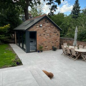 METRO-SILVER. Image shows silver tiles to patio in garden and steps with dog