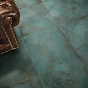 METALLIC-FLOOR-TILES-FORGE-MINT. Image shows metallic green tiles to floor of lounge with brown leather sofa