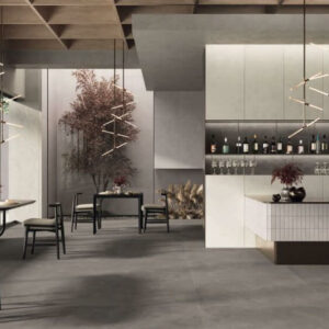 BLEND-PEAT-CEMENT-LOOK-PORCELAIN-TILE-CAFE. Image shows dark brown cement look porcelain tile in cafe with tables and chairs