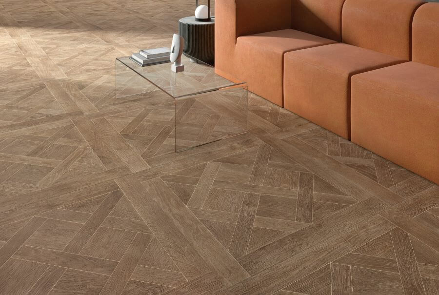 LOUIS-COGNAC-PORCELAIN-FLOOR-TILE-THAT-LOOKS-LIKE-WOOD. Image shows close up of dark brown porcelain floor tile that looks like wood