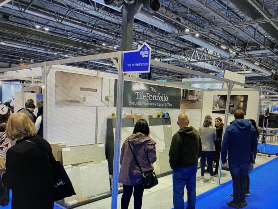 HBR-BIRMINGHAM. Image shows people on exhibition stand talking and looking at tiles