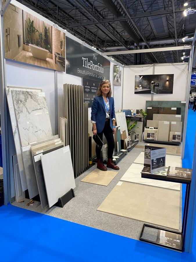 HBR-BIRMINGHAM. Image shows lady on exhibition stand surrounded by tiles