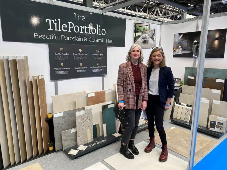 HBR-EXHIBITION-BIRMINGHAM-1. Image shows two ladies on exhibition stand surrounded by tile stands