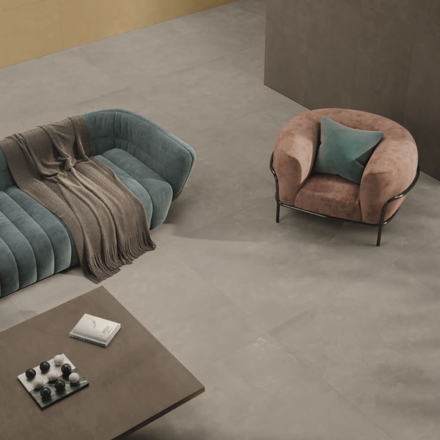 BLEND-DOVE-CEMENT-LOOK-PORCELAIN-TILE-CLOSEUP. Image shows grey large format porcelain tile on lounge floor
