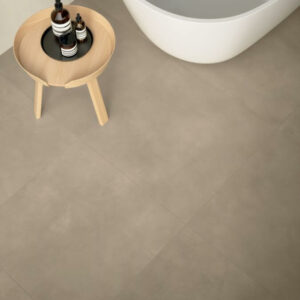 TOAST-BISCOTTI-CONCRETE-EFFECT-TILES-BATHROOM. Image shows taupe concrete effect tile on bathroom floor.