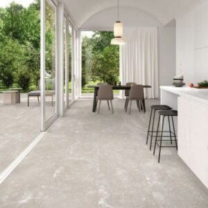 DOCKLANDS-BEIGE-CEMENT-PORCELAIN-TILE. Image shows beige cement porcelain tile in kitchen and onto patio