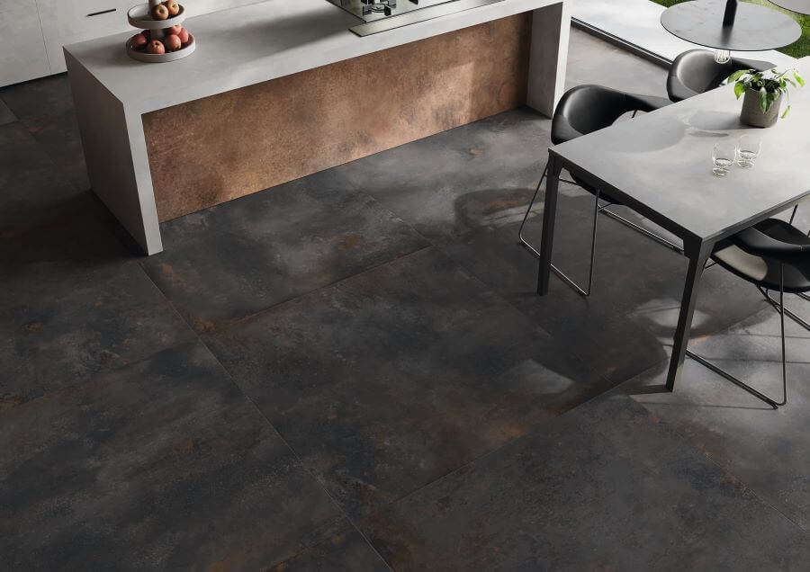 FORGE-TUNGSTEN-PORCELAIN-METALLIC-TILES-FLOOR. Image shows black brown metallic tiles to floor of kitchen