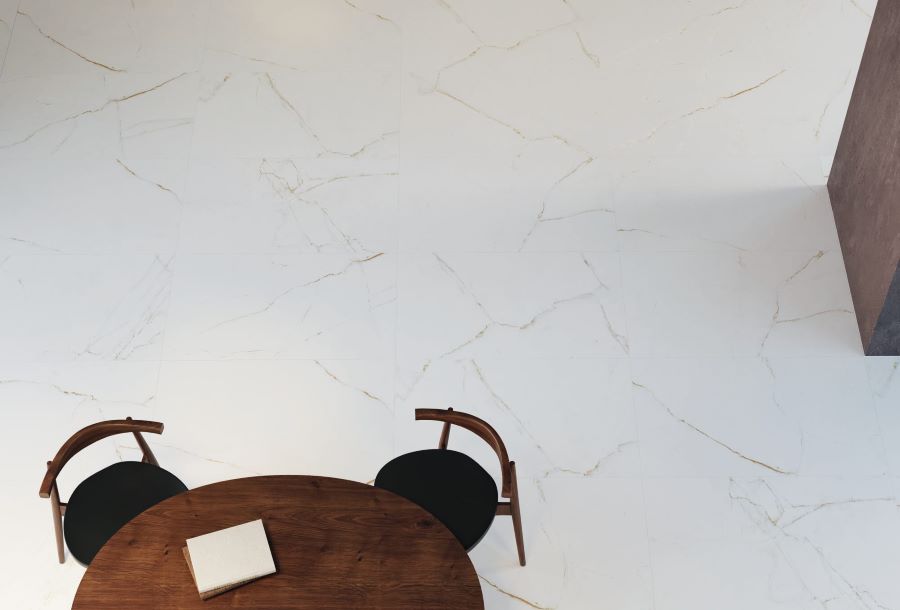 JEWEL-MARBLE-EFFECT-PORCELAIN-FLOOR-TILE. Image shows white marble effect porcelain tile with nutmeg veins with table and chairs