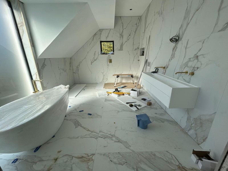 MACCHIA-VECCHIA-BATHROOM-4. Image shows large marble tiles in bathroom