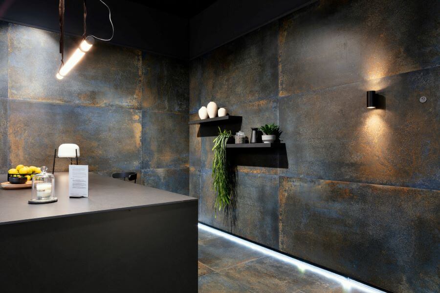 PATINA-BLUE-METALLIC-FINISH-TILES-KITCHEN. Image shows rusty blue black metallic finish tiles in kitchen