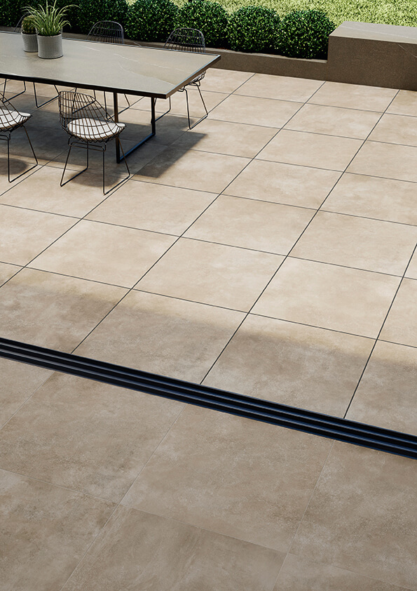 STRIDE-ARENA-20MM-CONCRETE-PORCELAIN-TILE. Image shows sand 20mm concrete porcelain tile on patio