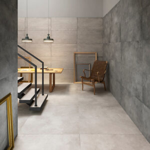 STRIDE-SCALE-AND-ICON-CONCRETE-PORCELAIN-TILE. Image shows light cream and mid grey concrete look porcelain tiles with staircase