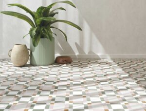 MOTIF-PATTERNED-WALL-TILE-PINK-BLOCK. Image shows pink and grey geometric patterned wall tile with plant