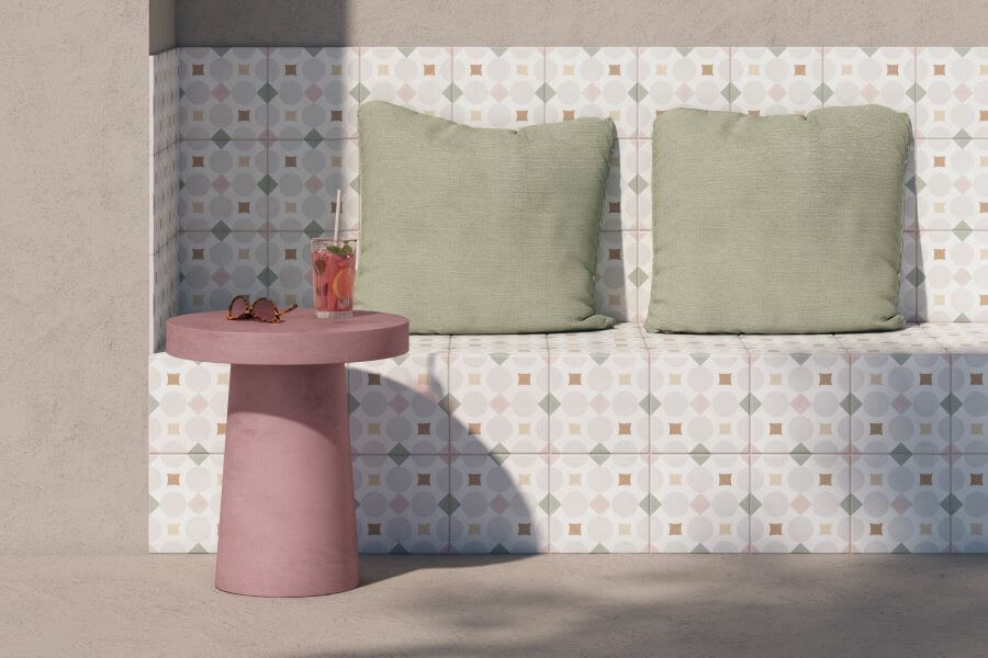 MOTIF-PATTERNED-WALL-TILE-PINK-SHAPES. Image shows pink and grey geometric patterned wall tiles on a bench
