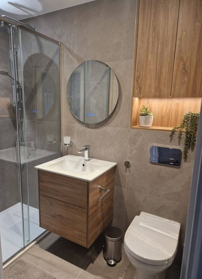 Image shows Aspect Ash tiles in bathroom shower