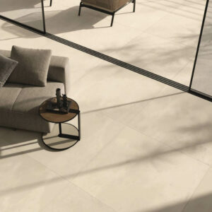 BLEND-INDOOR-OUTDOOR-FLOORING-MATCHSTICK. Image shows cream indoor outdoor tiles in lounge and onto the patio