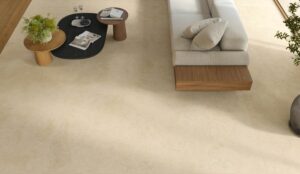 JOY-PORCELAIN-STONE-TILE-SAND-1.Image shows sand tile in lounge with sofa and coffee table
