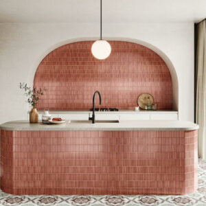 HUSH-CERAMIC-KIT-KAT-WALL-TILE-CHERRY. Image shows red kit kat tile in a kitchen on an island unit with cooker to the left