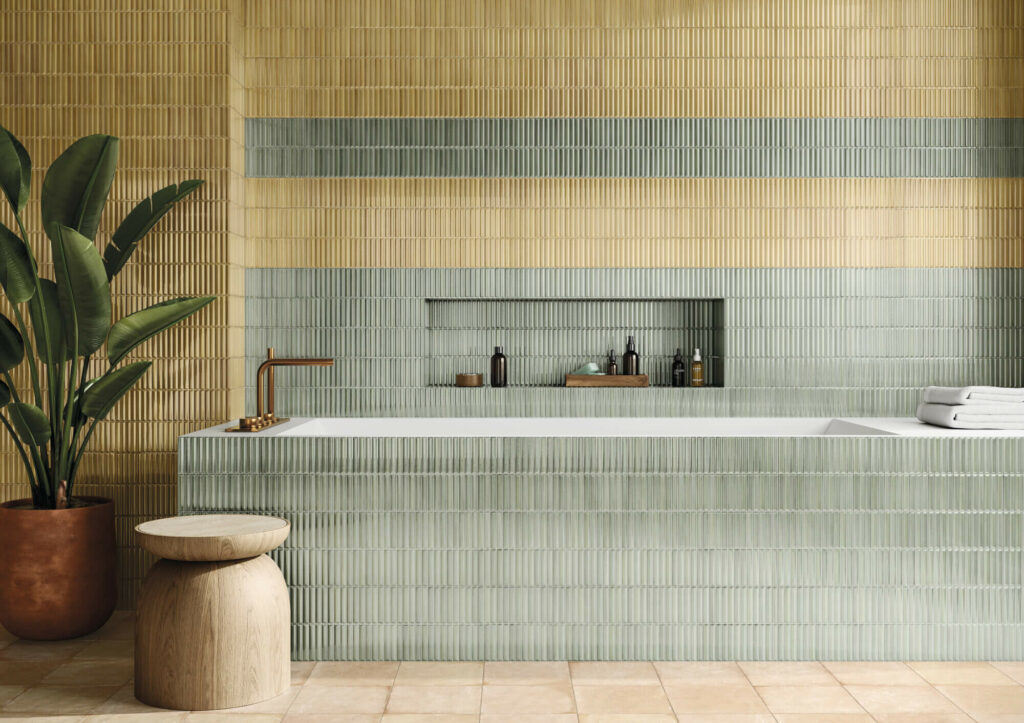 HUSH-CERAMIC-KIT-KAT-WALL-TILE-OLIVE. Image shows olive kit kat wall tile around bath and on wall behind with yellow kit kat tile