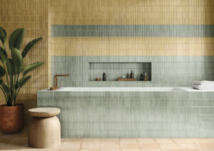 HUSH-CERAMIC-KIT-KAT-WALL-TILE-OLIVE. Image shows olive kit kat wall tile around bath and on wall behind with yellow kit kat tile