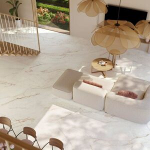 Blush pink marble effect porcelain tiles in white and pink in open-plan lounge with sofa.