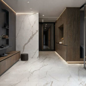 CALACATTA-MARBLE-PORCELAIN-TILE-LIGHT. Image shows calacatta marble effect porcelain tile in a hallway