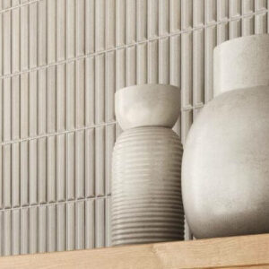 HUSH-CERAMIC-KIT-KAT-WALL-TILE-SAND-1. Image shows kit kat wall tile in sand with vases on wooden shelf