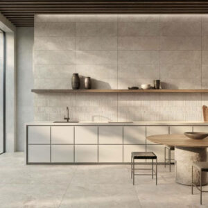 NATURE-PORCELAIN-SANDSTONE-EFFECT-TILES-BONE. Image shows a sandstone effect tile in a kitchen area