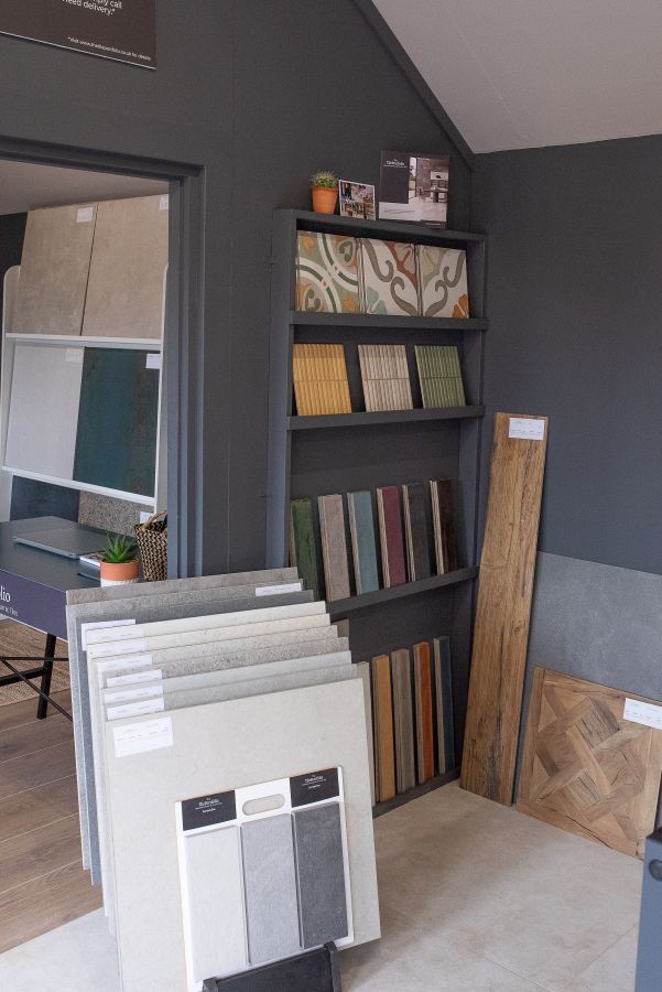 Showroom 9. Image shows corner of a tile showroom with colourful tiles