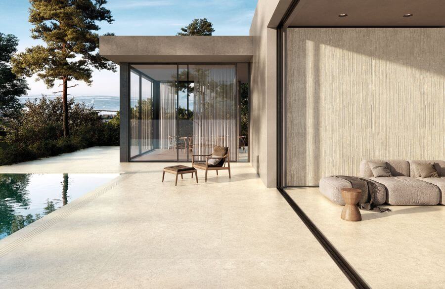 Seamless transition from patio to interior using 20mm Warm Taupe Cherish outdoor porcelain tiles and matching indoor stone-effect flooring.