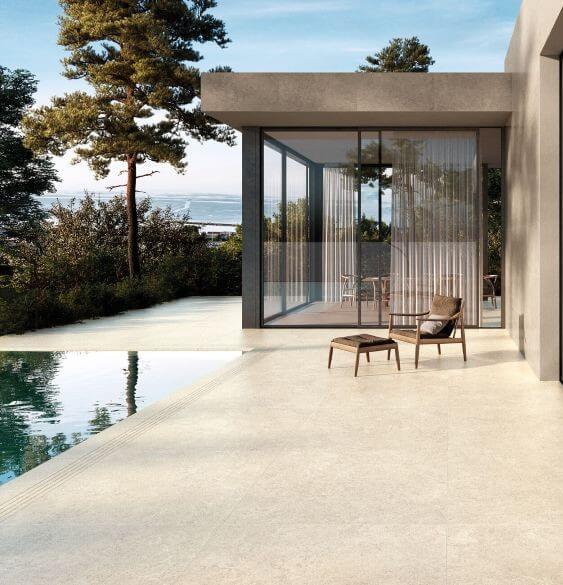 Modern patio featuring 20mm thick Warm Taupe Cherish outdoor porcelain pavers in a large format 1m x 1m layout.