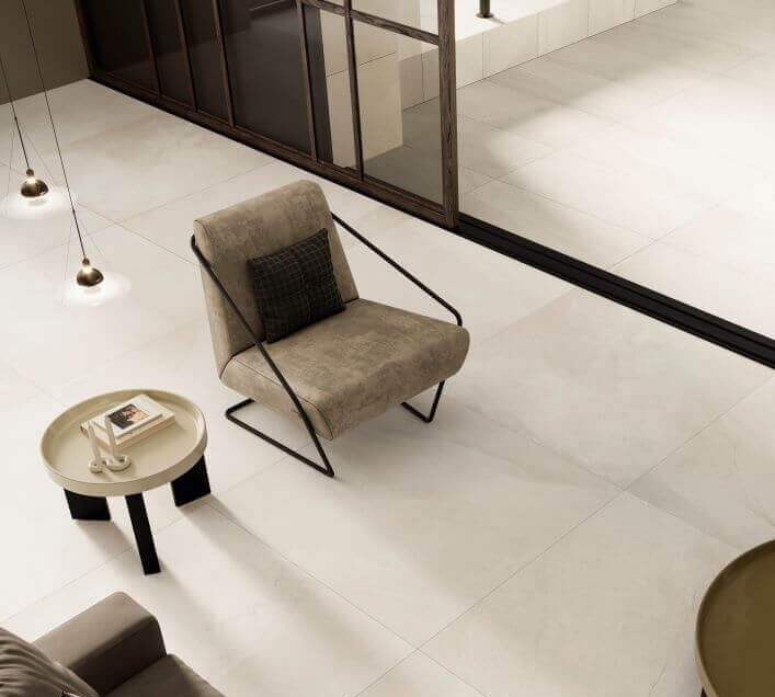 Ethos Shore stone look porcelain floor tiles installed in a contemporary open-plan living space